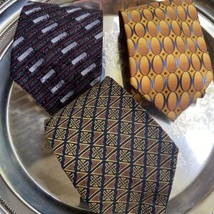Three men’s silk ties by Patrick Francis, Paola Cerrati, and Alexander Julian.